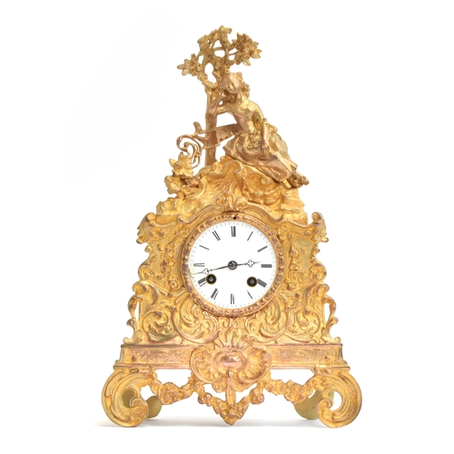 56 - An ornate French ormolu mantel clock, c.1850, the white enamel dial with Roman numerals, within scro... 