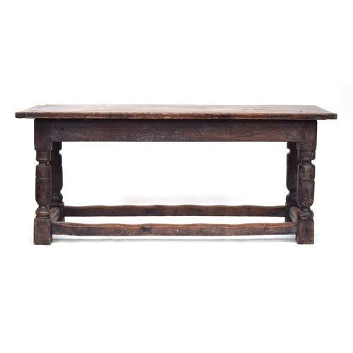 583 - An 18th century and later refectory table, three plank elm top with cleated ends, on block turned su... 