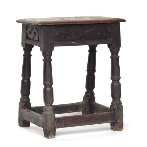 509 - An oak joint stool, carved frieze, on block turned legs and peripheral stretchers, 52cm high