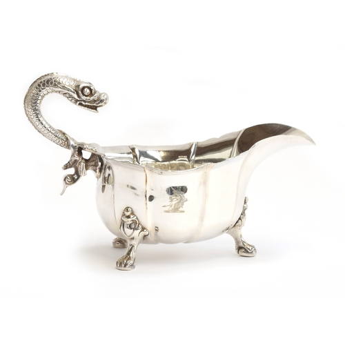 89 - A George III silver sauce boat of generous proportions, maker's mark rubbed, London 1762, with reari... 