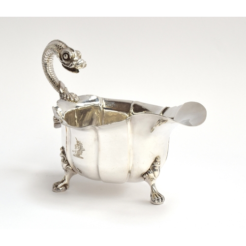 89 - A George III silver sauce boat of generous proportions, maker's mark rubbed, London 1762, with reari... 