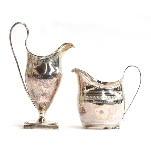 81 - A George III silver helmet form milk jug, London 1804, with beaded rim, bright cut decoration, raise... 