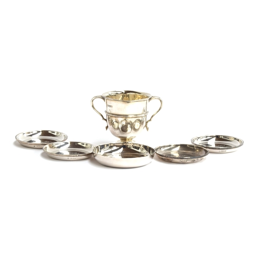 109 - A small twin handled trophy cup by William Hutton & Sons Ltd, 8cm high; together with four silver pi... 