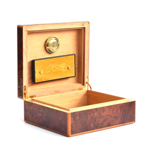 129 - An Elie Bleu of Paris burr walnut cigar humidor, fitted with a hygrometer, 25x22x10.5cm