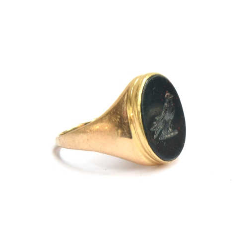 2 - A gold signet ring, the intaglio bloodstone engraved with a single martlet, 8.6g