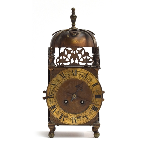 503 - An early 20th century striking lantern clock having a 13cm dial with Roman numerals, the back plate ... 