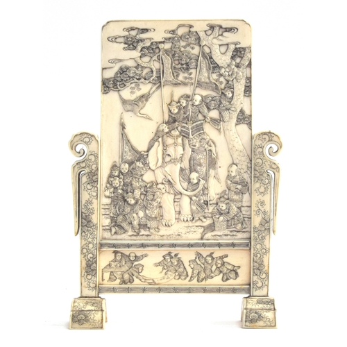 196 - A Japanese Meiji era ivory table screen, finely carved with scenes of Karako boys riding an elephant... 