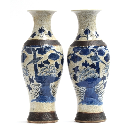 210 - A pair of early 20th century Chinese blue and white crackle glaze vases, depicting birds perched upo... 