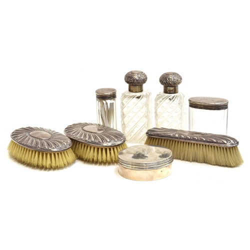 142 - Various silver dressing table items, including a pair of clothes brushes, pair of silver topped glas... 