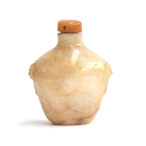 193 - A Chinese white and russet jade snuff bottle, flattened ovoid form and carved mask handles, with har... 