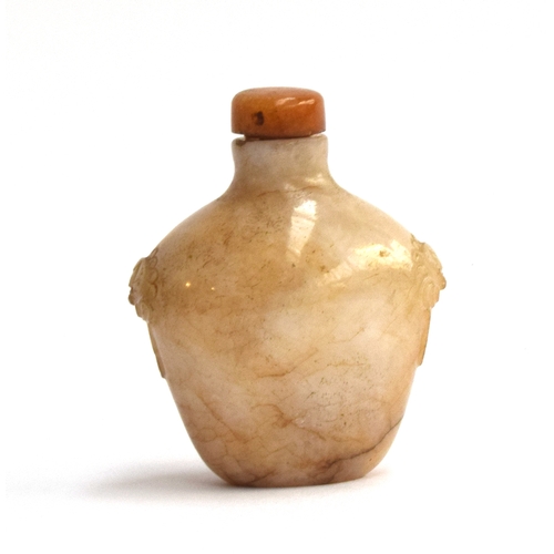 193 - A Chinese white and russet jade snuff bottle, flattened ovoid form and carved mask handles, with har... 