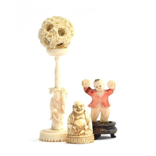 195 - A 19th century Chinese puzzle ball, 5cm diameter and stand 12cm high; together with a stained ivory ... 