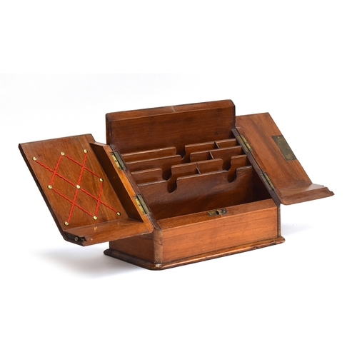 588 - A Victorian walnut sloped writing box, opening to an arrangement of letter racks, pen rest, and draw... 