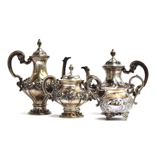 76 - A Portuguese 833 standard silver service, chased with scrolls, comprising teapot, coffee pot, and su... 