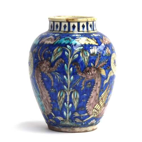 261 - A possibly Samson Iznik style vase depicting dragons and serpents amongst lotus flowers on a cobalt ... 