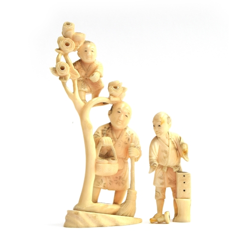 194 - A 19th century Japanese ivory okimono depicting a father and son, the son climbing a flowering tree ... 