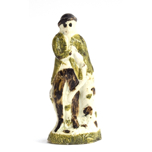 236 - An Astbury-Whieldon figure of a man, c.1745, bears label for the 'L. J Wickes Collection', 13cmH