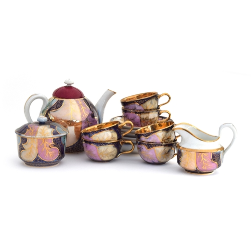 247 - A late 19th/early 20th century Russian Kuznetsov tea set, 15 pieces, with gilt leaf design on a coba... 