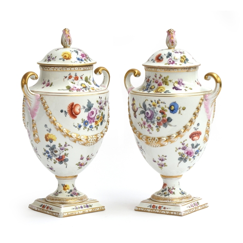 248 - A pair of Dresden Helena Wolfsohn urns and covers, each with baluster body and scrolled handles, mou... 