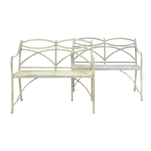 627 - A pair of Regency style wrought iron garden benches, 102cm wide