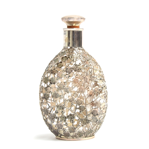 133 - A whiskey dimple bottle, with all over .950 silver prunus lattice, 22cm high