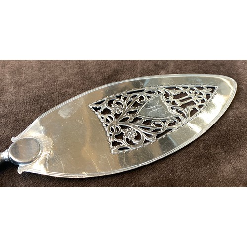 66 - A George III silver fish slice, by William Plummer, London 1784 (the handle marked TM), the floral p... 