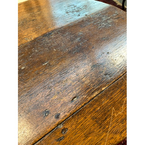 550 - An early 19th century ash and elm cricket table, the three plank circular top on three splayed legs,... 