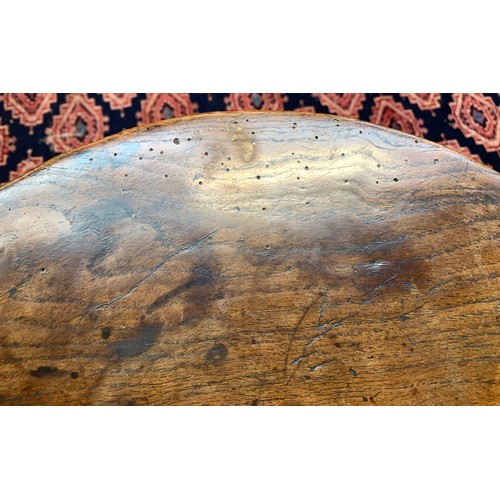 549 - An early provincial 'cricket' table, the exceptionally thick circular oak top on three splayed legs,... 