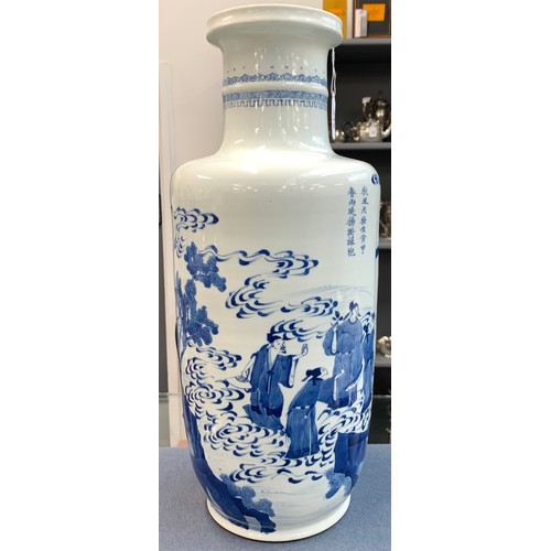 215 - A blue and white Chinese rouleau vase, depicting court scenes and a landscape amidst swirling clouds... 