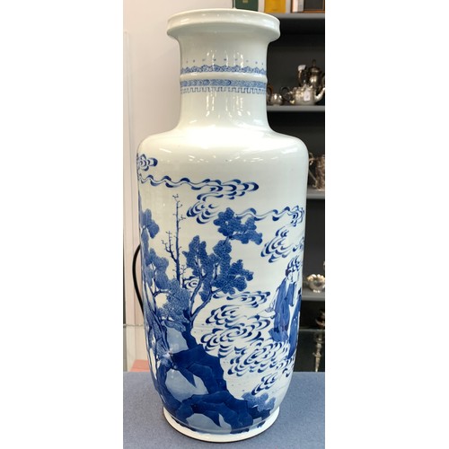 215 - A blue and white Chinese rouleau vase, depicting court scenes and a landscape amidst swirling clouds... 