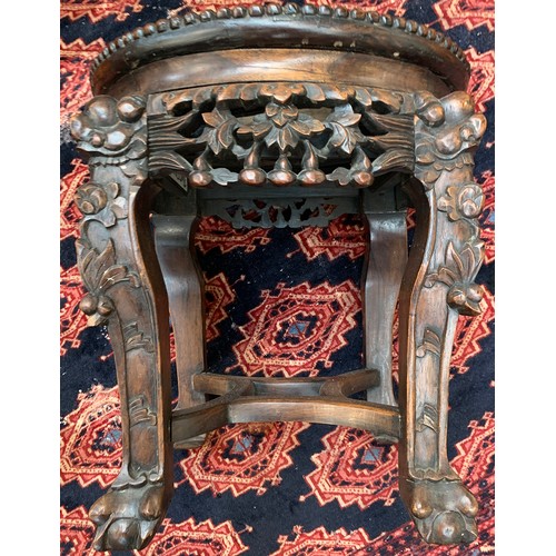 624 - A 19th century Chinese hardwood jardiniere stand, with circular inset marble top, on four carved leg... 