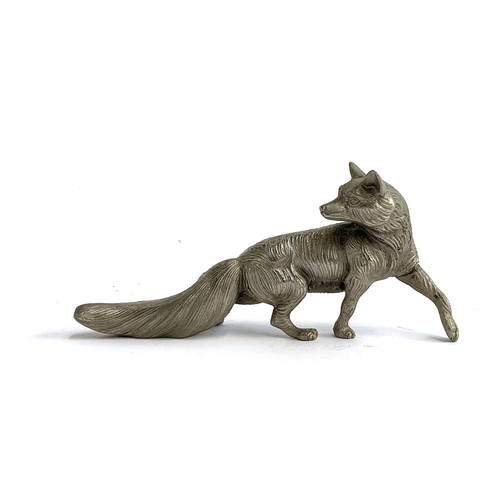 124 - A cast metal figure of a fox, 22cmL