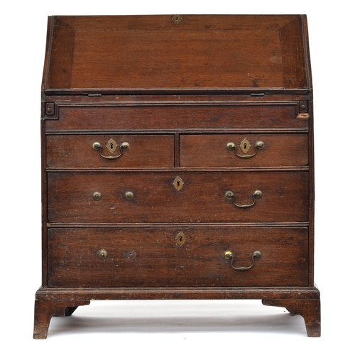 602 - A George II and later oak bureau, the fall enclosing a fitted interior with well, over two short and... 