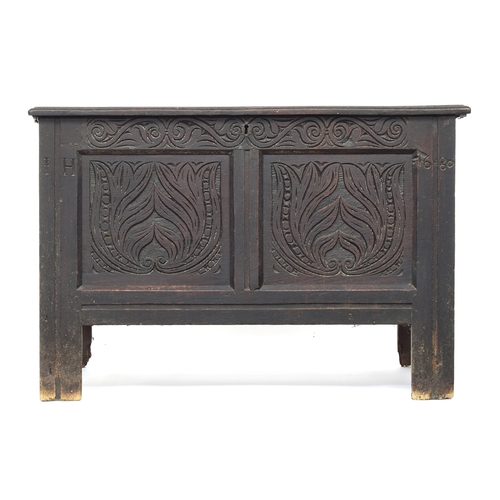 579 - A two panel carved oak coffer, inscribed IH 1680, two plank hinged lid, 106cm wide, 54cm deep, 70cm ... 