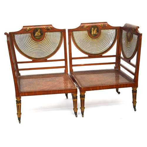 655 - A pair of Edwardian Adam revival satinwood and parcel painted corner armchairs, each with painted cr... 