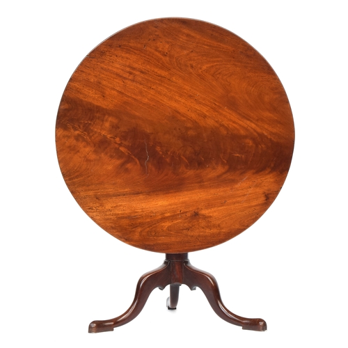 619 - A Regency mahogany tripod table, the single piece circular tilt-top on a wrythen base and cabriole l... 