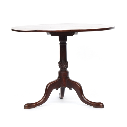 619 - A Regency mahogany tripod table, the single piece circular tilt-top on a wrythen base and cabriole l... 