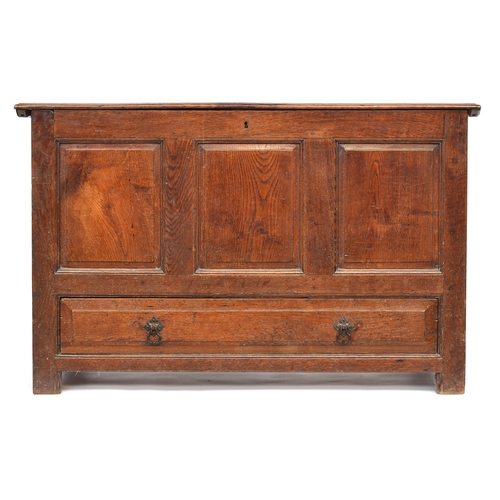 587 - An 18th century oak mule chest, two plank top over three fielded panels above single drawer, 122cm w... 