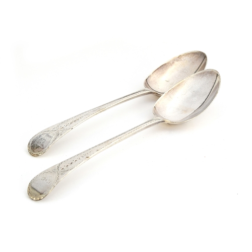 127 - A pair of bright cut George III silver spoons, maker's mark IP, London 1789, the terminals monogramm... 