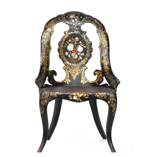 662 - A Victorian papier mache ebonised and parcel gilt chair, inlaid with mother of pearl, caned seat