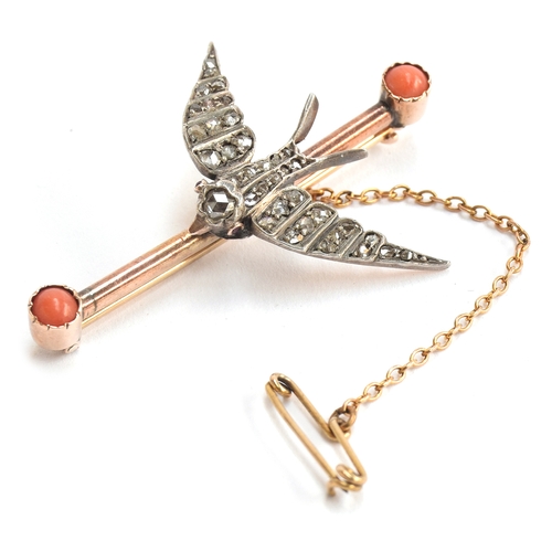 18 - A Victorian swallow bar brooch, the white metal swallow set with old cut diamonds and ruby eyes, the... 