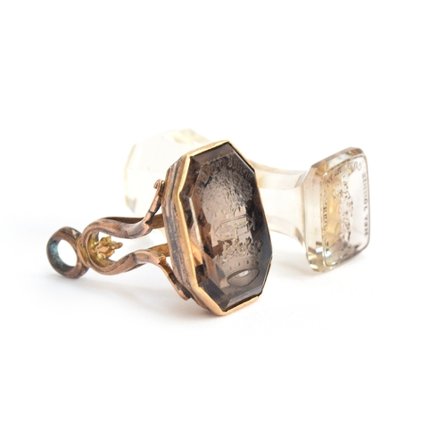 46 - A yellow metal fob seal with large smoky quartz intaglio, 2.2cm wide, approx. 10.5g; together with a... 