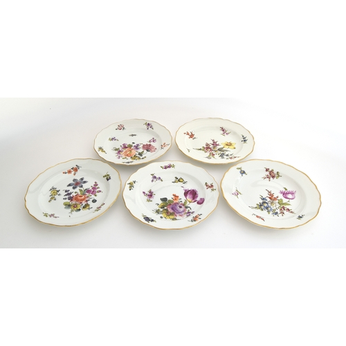 278 - A set of five 20th century Meissen plates, with hand painted floral design, the rim heightened in gi... 