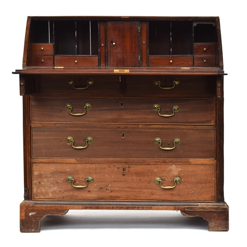 603 - A George III and later mahogany bureau, the later fall front opening to an interior of pigeon holes ... 