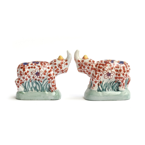 259 - A pair of early 20th century Chinese imari style rhino figurines by YaYou Zhen Cang, each signed to ... 