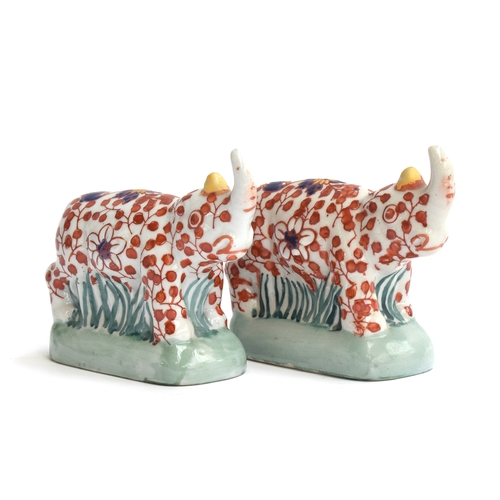 259 - A pair of early 20th century Chinese imari style rhino figurines by YaYou Zhen Cang, each signed to ... 