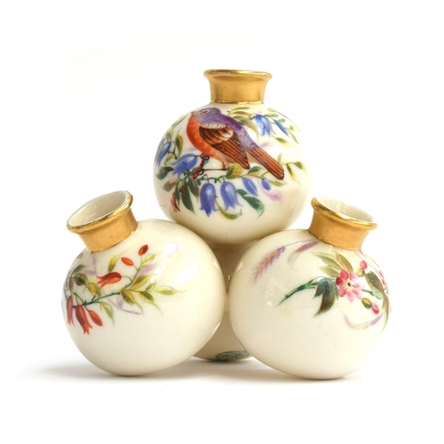 269 - A 19th century Royal Worcester conjoined quadruple orb vase, with hand painted songbirds within flor... 