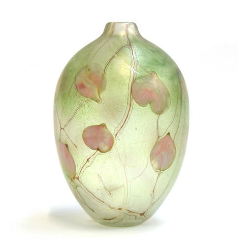 303 - A Siddy Langley (b.1955) iridescent art glass vase, pink petal design on a green ground, signed and ... 