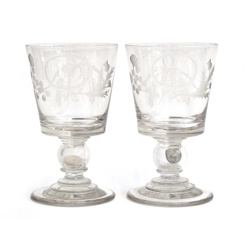 295 - A pair of George III 'coin' goblets or rummers, each with tapering bowl engraved with wheatsheafs, f... 