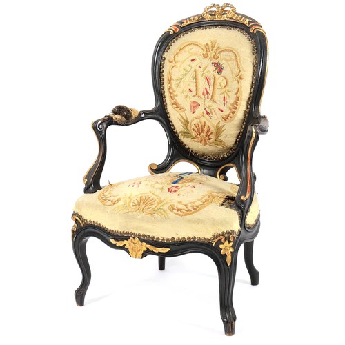 663 - A Victorian ebonised and parcel gilt child's fauteuil, second half 19th century, with a ribbon carve... 